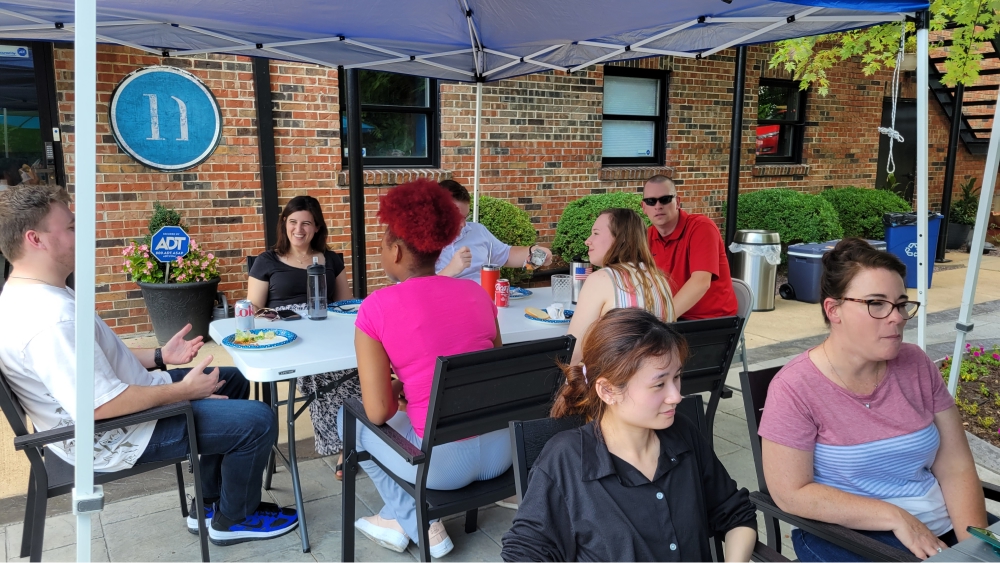 Notion team members socializing outdoors.