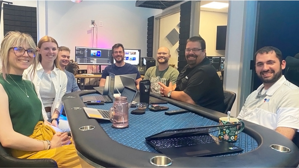 Interns and team members gathered around a table.