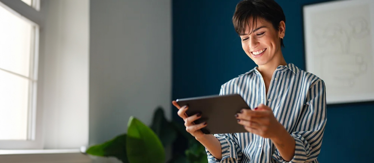 Person viewing a tablet.