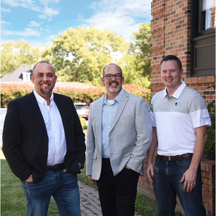 Louis, John, and Matt standing in front of the Notion office.