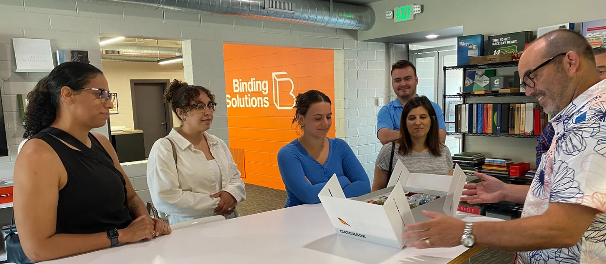 Interns and team members gathered around a table.