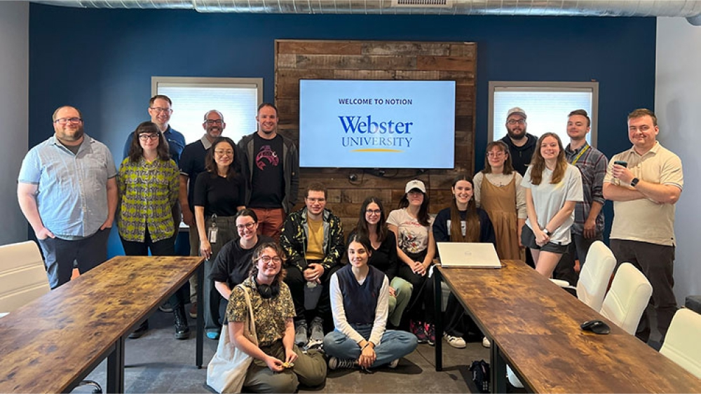 Team members with Webster University students.