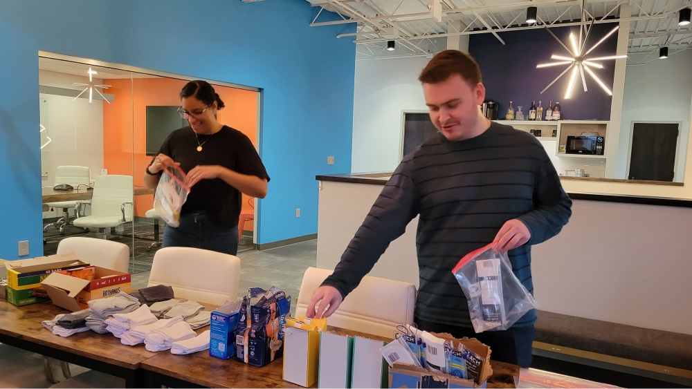 Team members packing gift bags.