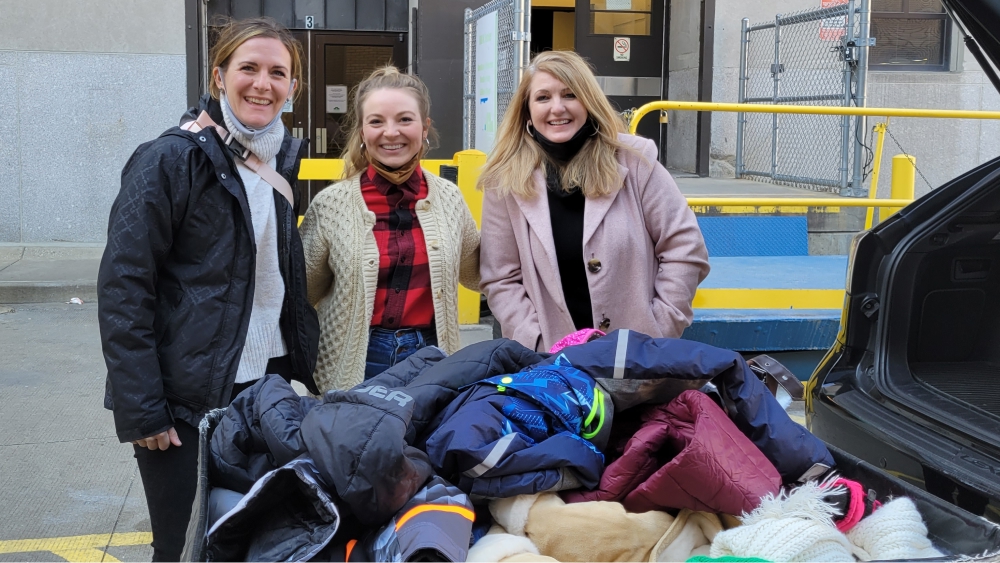 Team members with donated items.